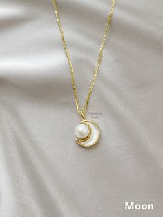 "△ DETAILS * 100% Genuine natural freshwater pearls, real pearl * Natural white color pearls, high luster, AAAA grade * 14K gold plated with mother of pearl, crescent moon or star shape can be choose from * 18K gold vermeil sterling silver chain, 18 inches (45cm) length * Delicate and daily wear necklace, perfect for yourself or as a gift * Ready for gifting, packed in a beautiful jewelry box * Handmade in USA ♥ Pearl Size: 6.5-7.5 mm ♥ Pearl Shape: Round ♥ Pearl Color: White ♥ Chain Length: 18 White Gold-plated Pearl Necklace For Anniversary, Elegant White Moon-shaped Necklace, Elegant Moon-shaped Necklace With Pearl Pendant, Elegant White Jewelry With Moon Phase Detail, Elegant White Moon Phase Jewelry, Daily Wear Necklace, Necklace Star, Gemstone Properties, Fairy Jewelry