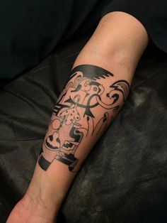 a person with a black and white tattoo on their arm