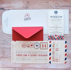 an envelope and boarding cards on a wooden table