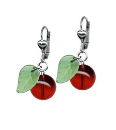 Create a sweet and timeless look in our cherry earrings! These fun earrings feature a red cherry with a single green glass leaf. Lightweight and easy to wear! Can be paired with our matching necklace and bracelet to make a set! Made in our sunny studio in Los Angeles, CA *Cherry measures approx .50" round *Leaf measures approx .25" tall by .25" wide *Hypoallergenic *Silver plated lever back earrings *High quality construction Rockabilly Earrings, Hardware Jewelry, Green Cherries, Cherry Earrings, Necklace Extender, Retro Jewelry, Necklace Box, Matching Necklaces, Style Earrings