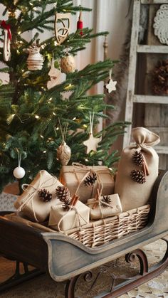 a christmas tree with presents in a sleigh