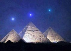 three pyramids with the sky in the background and an image of two stars above them