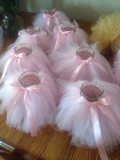 several pink tutuffs are sitting on a table