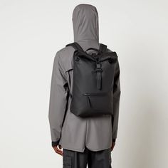 Sleek and functional, the Rain's Rolltop backpack features an all-black design with a showerproof matte shell outer and aqua seal trims for protection from the elements. The rucksack has a front zipped pocket for easy access to your everyday belongings while on the go. The spacious main compartment is perfect for fitting everything you need for a weekend away..Style Notes:.Rains Rolltop rucksack.Black matte shell.Top handle, shoulder straps, front zipped pocket.Clip front flap closure.Size & Fit:.Dimensions: H: 56cm x W: 31cm x D: 5cm Waterproof Black Bag, Urban Style Waterproof Backpack, Urban Waterproof Backpack For Outdoor Activities, Urban Style Waterproof Backpack For Outdoor Activities, Functional Black Waterproof Backpack, Black Waterproof Bag, Functional Waterproof Nylon Backpack, Functional Nylon Waterproof Backpack, Black Waterproof Outdoor Backpack