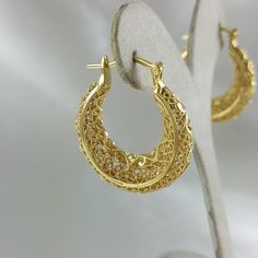 Indulge in the elegance and simplicity of our Exclusive Filigree Hoop Earrings! Featuring classic and timeless filigree design, these earrings add instant glamour and comfort to any outfit. Elevate your style and make a statement with our exclusive scrollwork contour hoop earrings. A must-have for any jewelry lover! Filigree Hoop Earrings, Filigree Design, Gold Filigree, Pendant Rings, Chain Earrings, Jewelry Lover, Elevate Your Style, Earring Necklace, Your Style