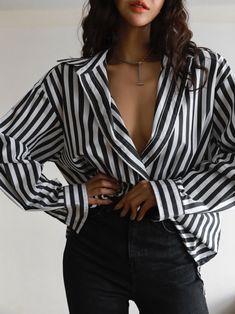 A luxe cotton-blend oversized dress shirt with longer length and button down. Black and white stripes create a sophisticated look. Slight stretch from spandex material. Model is wearing MINUSEY S. ✔️ Free worldwide express shipping over $100✔️ Loved by 6,500+ customers✔️ Limited edition collections, maximum style⠀⠀⠀⠀⠀⠀⠀⠀⠀Stay ahead of the trend with can’t-find-anywhere-else staples. Your closet will thank you 💕 * MINUSEY S = EU 34, US 2* MINUSEY M = EU 36, US 4* 70% Cotton / 27% Nylon / 3% Spandex* Dry clean* Made in Korea - Model Height: 170cm/5'7" (US2, EU34) Trendy Striped Office Shirt, Trendy Striped Workwear Shirt, Vertical Striped Long Sleeve Shirt For Day Out, Vertical Stripes Long Sleeve Shirt For Day Out, Oversized Striped Collared Blouse, Chic Office Shirt With Vertical Stripes, Oversized Button-up Blouse With Vertical Stripes, Long Sleeve Shirt With Vertical Stripes For Day Out, Chic Vertical Stripes Office Shirt