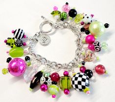 Make a statement with this beautiful bracelet. Silver wire wrapped freshwater pearls, glass pearls, cut Swarovski crystals, Czech glass, metal findings, and assorted glass beads are hung on a stainless steel chain and finished with a large toggle clasp.  This bright and colorful beaded charm bracelet comes with a variety of the charms shown with one on every chain link on the bracelet from end to end.  The bracelet length shown measures 7 inches and can be adjusted as requested and clasp can be changed to a large lobster clasp if requested prior to shipping. Please measure your wrist to insure a proper fit, prior to purchase.  All beads are wire wrapped by me with great attention to detail. Bead size, shape, and color composition may vary from picture slightly, making your bracelet unique Charm Bracelet Pink, Pink Heart Jewelry, Chunky Charm Bracelet, Sweetheart Jewelry, Snowflake Bracelet, Beaded Charm Bracelet, Hot Clothes, Work Necklaces, Bead Dangles