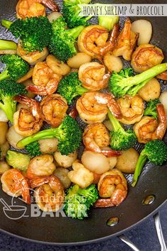 shrimp, broccoli and scallops cooking in a wok on the stove