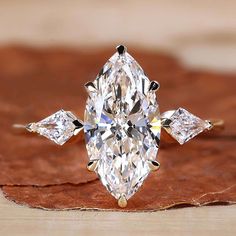 A marquise diamond engagement ring showcasing elegance and style. Marquise Cut Diamond Engagement Rings, Marquise Engagement Ring, Marquise Diamond Engagement Ring, Diamond City, Engagement Rings Marquise, Dream Engagement, Dream Engagement Rings, Man Made Diamonds, Marquise Cut Diamond