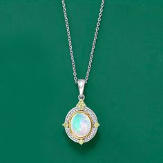 Ross-Simons - Ethiopian Opal, .10ct t. w. Diamond, .10ct t. w. Peridot Pendant Necklace, 14kt Gold. 18". Indulge in the beautiful color play of opal. This pendant necklace features an 8x10mm oval Ethiopian opal cabochon highlighted by .10 ct. t. w. round brilliant-cut diamonds and .18 ct. t. w. round peridots. Set in polished sterling silver with 14kt yellow gold circling the opal. Suspends from a cable chain. Lobster clasp, peridot, diamond and Ehiopian opal pendant necklace. Peridot birthstone Peridot Birthstone, Peridot Pendant, Opal Pendant Necklace, Color Play, Opal Pendants, Round Brilliant Cut Diamond, 14kt Gold, Ethiopian Opal, Cable Chain