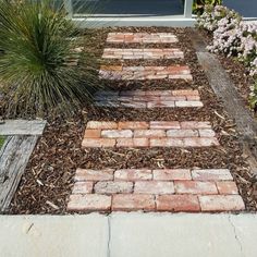 a brick path in front of a house