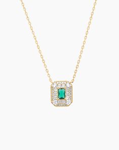 Elevate your style with our stunning Art Deco Necklace, plated in lustrous gold over sterling silver. Featuring a mesmerizing green spinel in an emerald cut as the center stone, this necklace is a true statement of elegance. The intricate design surrounding the center stone adds a vintage-inspired touch, paying homage to the Art Deco era. With a length of 16 inches plus a 2-inch extension, this necklace offers versatility in wearing and allows for the perfect fit. Gold Emerald Cut Emerald Necklace, Formal Emerald Necklace With Rectangular Pendant, Gold Emerald Cut Emerald Necklaces, Classic Green Necklace With Rectangular Pendant, Formal Green Necklace With Rectangular Pendant, Elegant Green Rectangular Necklace, Green Rectangular Pendant Necklace For Formal Occasions, Elegant Green Rectangular Necklaces, Gold Necklaces With Rectangular Stone For Formal Occasions