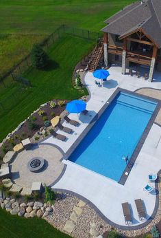 an aerial view of a pool and patio area