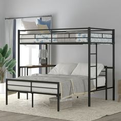 a black metal bunk bed sitting on top of a white rug