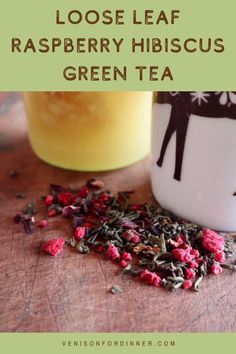 loose leaf raspberry hibiscus green tea in front of a glass jar