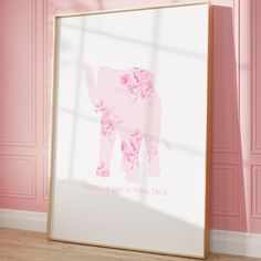 an elephant with pink flowers on it's trunk in front of a pink wall