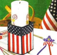 an american flag candle holder on a table