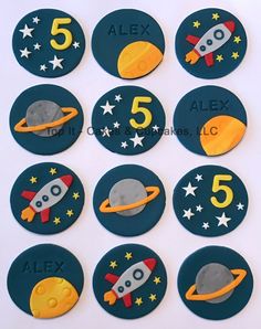 a set of nine space themed cookies with the numbers 5, 6, 8, and 9 on them