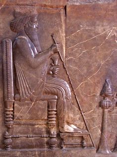 an ancient egyptian relief depicting the pharaoh and his wife