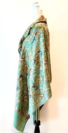 Artisan Embroidered Needlework On Silk Pashmina. Luxury Gift Item. This beautiful silk pashmina is handmade, illustrating birds and nature. A specialty item, 100% embroidered throughout the shawl. Absolutely gorgeous. The beauty of this shawl is evident and many collect these special pieces. A luxury shawl in every sense of the term. The base color is a soft creamy green, embroidery incorporates gold, cream, navy, copper, and red. This shawl is seasonless and may be worn through out the year. Ea Luxury Silk Pashmina Shawl With Resham Embroidery, Luxury Silk Pashmina Shawl With Intricate Embroidery, Traditional Silk Scarf For Spring, Traditional Pashmina Shawl For Spring, Spring Traditional Pashmina Shawl, Luxury Traditional Pashmina Shawl With Resham Embroidery, Luxury Shawl, Luxury Resham Embroidered Pashmina Shawl, Luxury Multicolor Embroidered Pashmina Shawl