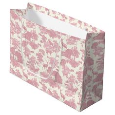 a pink and white shopping bag with trees on it