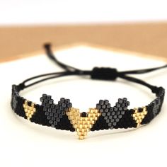 Hearts Miyuki Seed Bead Adjustable.Bracelet Gold And Black Boutique Item Offers Welcome Bundle And Save! Dm For More Info :-) Adjustable Heart Beads Bracelet With Round Beads, Heart-shaped Friendship Bracelet With Tiny Beads, Friendship Heart Bracelet With Tiny Beads, Heart Beads Beaded Bracelets For Party, Adjustable Beaded Bracelets With Heart Charm, Adjustable Heart Beads Bracelet For Jewelry Making, Beaded Heart Bracelets For Party, Black Bracelets With Tiny Beads For Party, Gold Beaded Bracelets With Heart Beads For Party