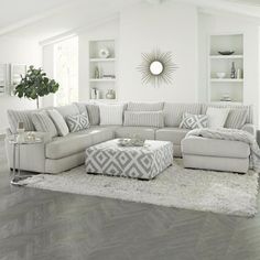 a living room filled with furniture and white walls