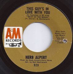 the label for herb alpert's album, this guy's in love with you