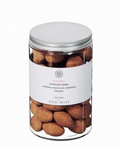 a jar filled with almonds sitting on top of a table