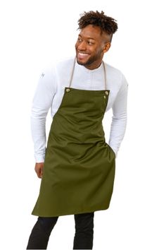 a man wearing an apron and smiling at the camera