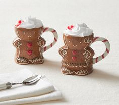 two salt and pepper shakers decorated to look like gingerbread men