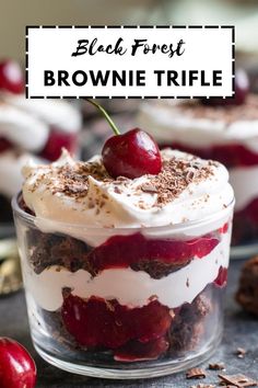 black forest brownie trifle in a glass dish with whipped cream and cherries