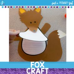 a paper cut out of a fox wearing a bib with the words fox craft on it