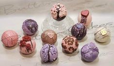 an assortment of decorated eggs sitting on top of a table