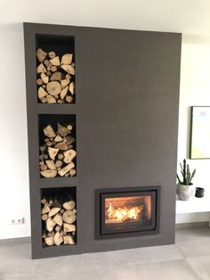 a fire place with logs in it