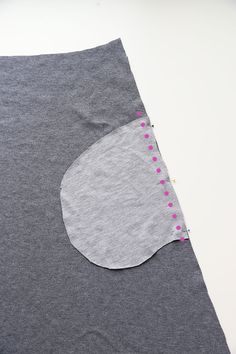 a piece of fabric with pink dots on it