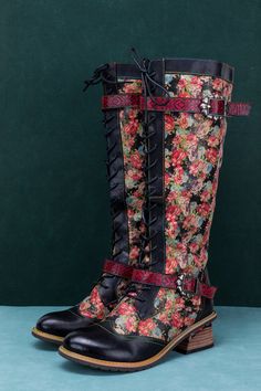 Step into style with our exclusive floral pattern tie-accent leather boots. These boots are made with premium leather, featuring a stunning floral pattern that is sure to turn heads. The tie accent adds a touch of elegance and allows for a personalized fit, ensuring that you can wear these boots with confidence all day long. So why wait? Elevate your shoe collection today with our Floral Pattern Tie-Accent Leather High Boots. 1.1'' heel 15.6" Shaft 16.8" Circumference Zip & lace-up closure Adjus Bohemian Round Toe Boots With Floral Print, Bohemian Floral Print Round Toe Boots, Black Leather Boots With Floral Print, Leather High Boots, Reindeer Headband, High Leather Boots, Knee High Leather Boots, Dress Jewelry, Knit Jumper