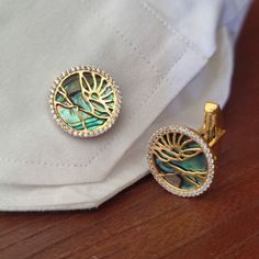 Abalone Shell Gold Cufflink, Solid 14K Yellow Gold Men Jewelry, Abalone Gemstone Cuff Link Designer Pave Diamond Cufflinks Gift For Him STONE DETAILS : ❋ Stone : Pave Diamond / Abalone Shell ❋ Stone Type : Natural ❋ Stone Size : 18 MM ❋ Stone Shape : Round Cabochon ❋ Stone Color : As Shown In Picture ❋ Stone Weight : 10.53 Cts. Approx. ❋ Diamond Weight : 0.66 Cts. Approx. ❋ Diamond Quality / Color : HI SI ❋ Diamond Size : 1.20MM ❋ Number Of Diamond : 82 Pieces METAL DETAILS : ❋ Metal Purity : So Luxury Diamond Cufflinks, Designer Cuff Jewelry For Anniversary, Elegant Round Diamond Cufflinks, Designer Round Cufflinks For Formal Occasions, Luxury Diamond Cufflinks For Anniversary, Luxury White Gold Round Cufflinks, Luxury Hallmarked Cufflinks For Anniversary, Round Hallmarked Cufflinks For Anniversary, Luxury Hallmarked Jewelry For Business