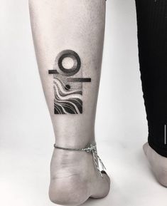 a person with a tattoo on their leg