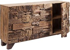 an old wooden cabinet with carvings on the doors and drawers, made out of wood