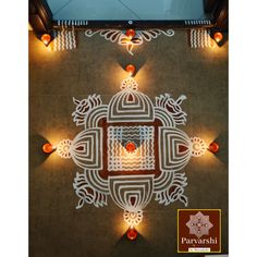 an overhead view of a decorated floor with candles and lights in the shape of a flower