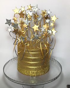 a cake with gold and silver stars on it