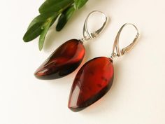 Small dark red amber earrings with silver sparkly burgundy | Etsy Baltic Amber Earrings As A Gift, Handmade Elegant Baltic Amber Earrings, Elegant Handmade Baltic Amber Earrings, Elegant Baltic Amber Dangle Jewelry, Modern Amber Earrings As A Gift, Modern Amber Earrings For Gift, Golden Logo, Christmas Gifts For Wife, Amber Earrings