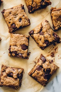 chocolate chip cookie bars on parchment paper with the words food written in white above them