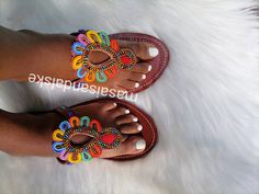 Maasai sandals is a unique simple beaded sandals made from real leather and has perfect flower made from Fines beads. Why you need the sandals? -it's light and durable hence it can be used during walk in the park, weekend outings, birthday party, beach party, working indoors and even driving since it's offers your feet enough ventilation and always stays fresh. -it's multicolored hence you won't be having problems of colour clashing. - it has a soft leather on the inner part which reduces fricti African Sandals, Summer Leather Sandals, Bohemian Sandals, Love My Sister, Beaded Sandals, Walk In The Park, Maasai, Waist Training, Summer Sandals