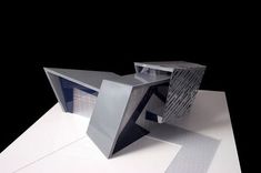 an architectural model is displayed on a white surface