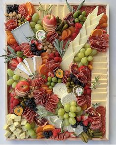 an art work made out of fruits and cheese