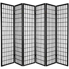 a black and white room divider with four panels on each side, in front of a