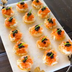 smoked salmon and cavia appetizer on a white platter with text overlay that reads smoked salmon and cavia appetizer