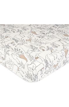 an image of a baby crib sheet with animals and plants on it's side